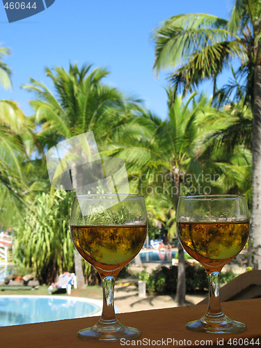 Image of beer glasses in a tropical environment