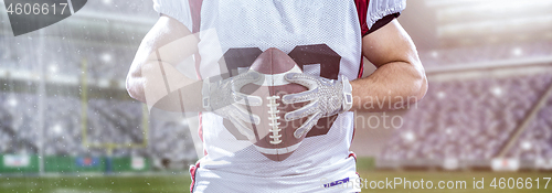 Image of closeup American Football Player isolated on big modern stadium