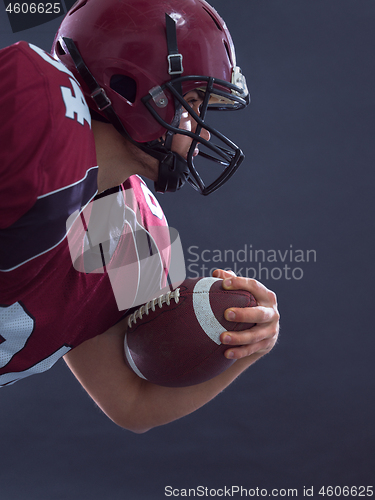 Image of American football Player running with the ball