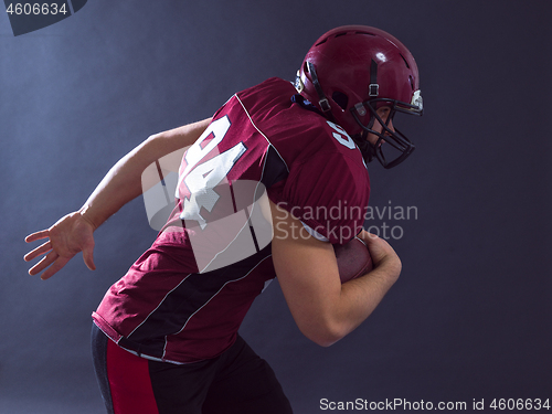 Image of American football Player running with the ball