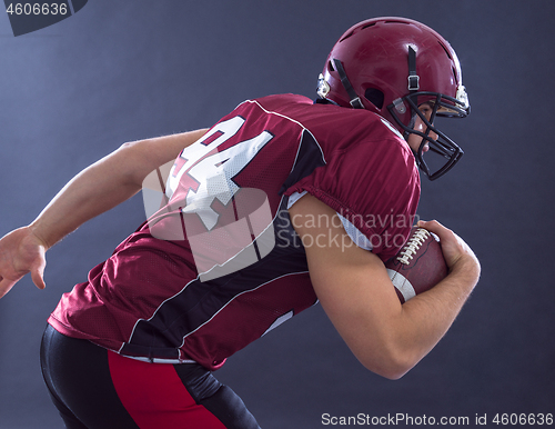 Image of American football Player running with the ball