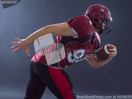 Image of American football Player running with the ball