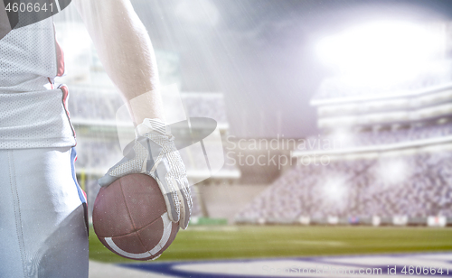 Image of closeup American Football Player isolated on big modern stadium