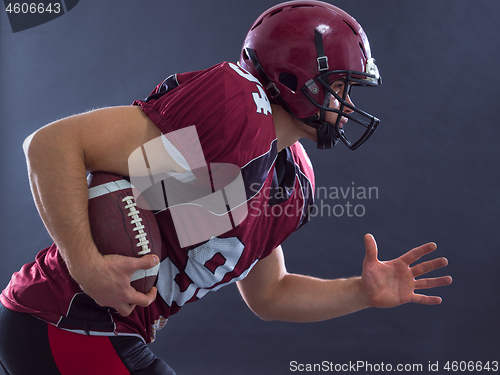 Image of American football Player running with the ball