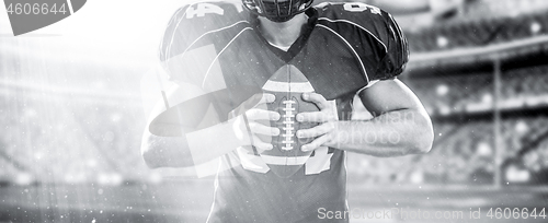 Image of closeup American Football Player isolated on big modern stadium