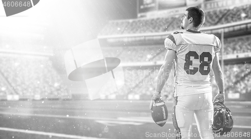 Image of American Football Player isolated on big modern stadium field