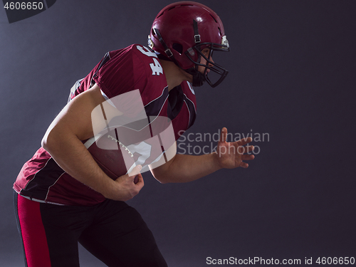 Image of American football Player running with the ball