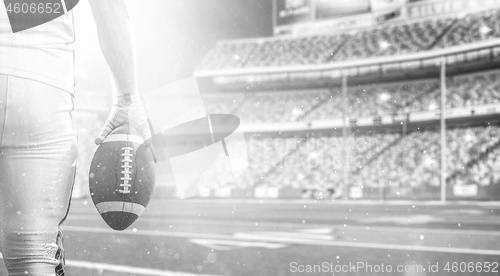 Image of closeup American Football Player isolated on big modern stadium