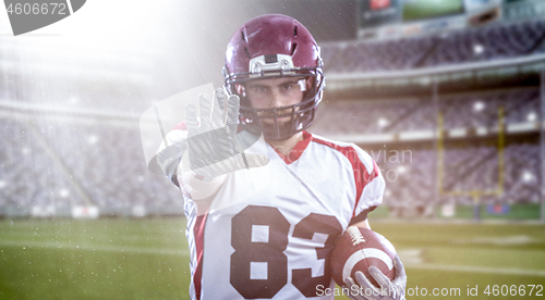 Image of portrait of confident American football player