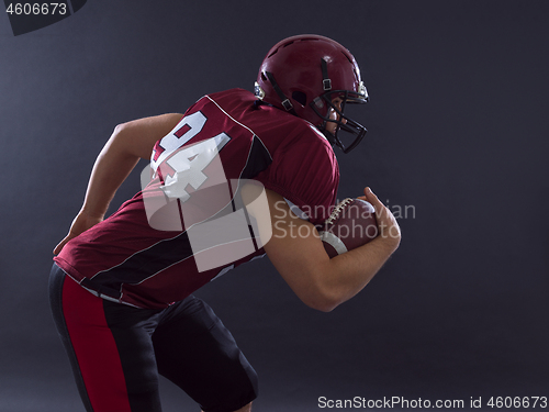 Image of American football Player running with the ball