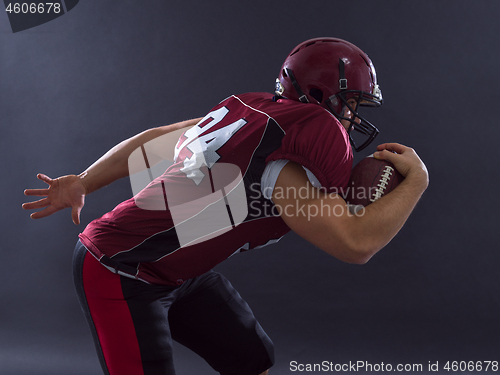 Image of American football Player running with the ball