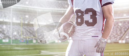 Image of closeup American Football Player isolated on big modern stadium