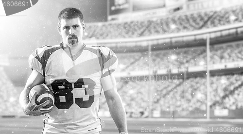 Image of American Football Player isolated on big modern stadium field