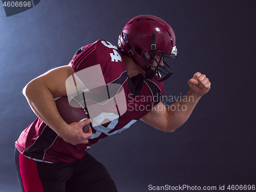 Image of American football Player running with the ball