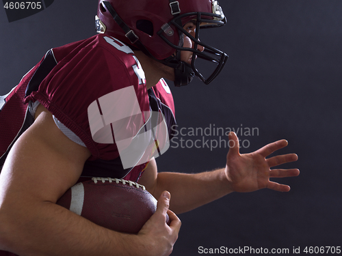 Image of American football Player running with the ball