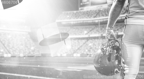 Image of closeup American Football Player isolated on big modern stadium