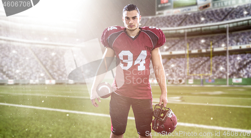 Image of American Football Player isolated on big modern stadium field