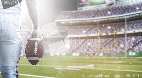 Image of closeup American Football Player isolated on big modern stadium