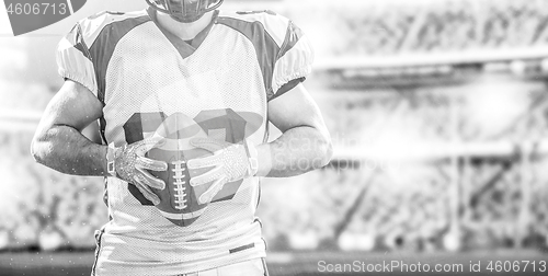 Image of closeup American Football Player isolated on big modern stadium