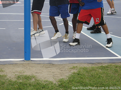 Image of basketball players on a court