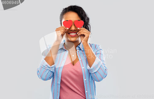 Image of happy african american woman with eyes of hearts