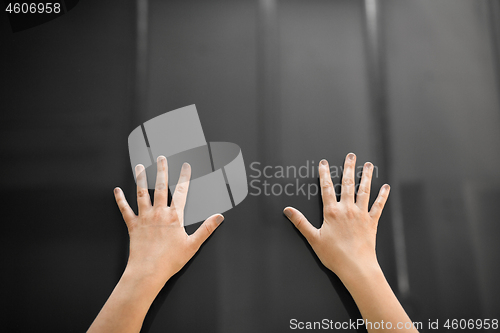 Image of hand using black interactive panel