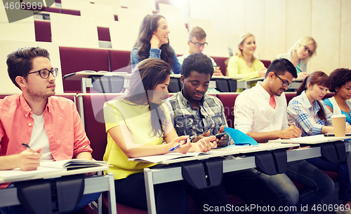 Image of group of students with smartphone at lecture