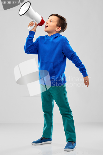 Image of smiling boy speaking to megaphone