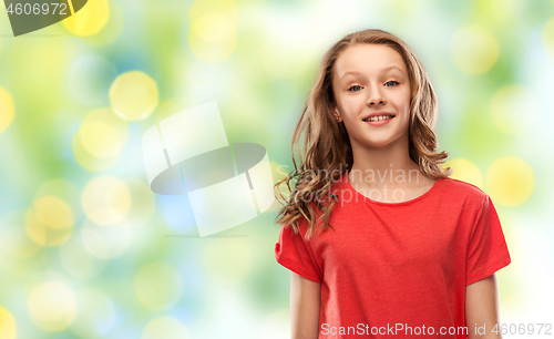 Image of teenage girl in red t-shirt over green lights