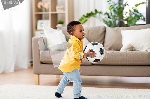 Image of african american baby boy playing with soccer ball