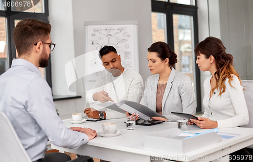 Image of recruiters having job interview with male employee