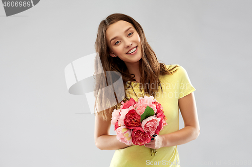 Image of young woman or teenage girl with flower bouquet