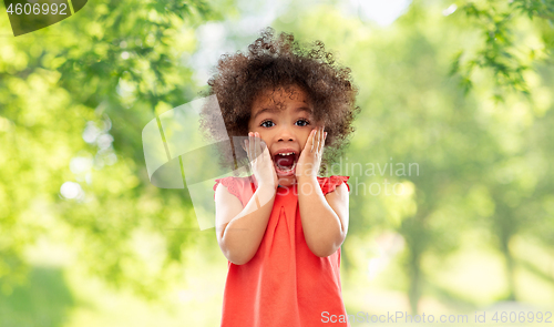 Image of surprised little african american girl in summer