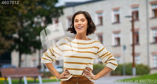 Image of smiling woman or student girl with hands on hips