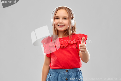 Image of smiling girl in headphones listening to music