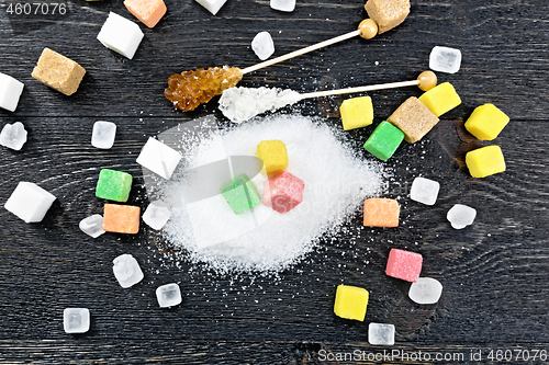 Image of Sugar of different colors and shapes on board top