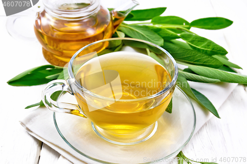 Image of Tea herbal with sage in cup on white board