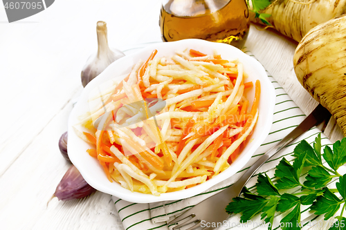 Image of Salad of parsnip and carrot on light board