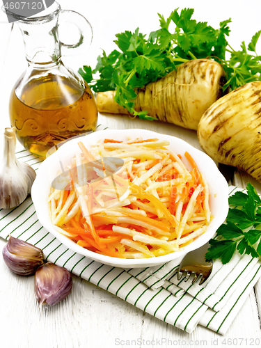 Image of Salad of parsnip and carrot on white board