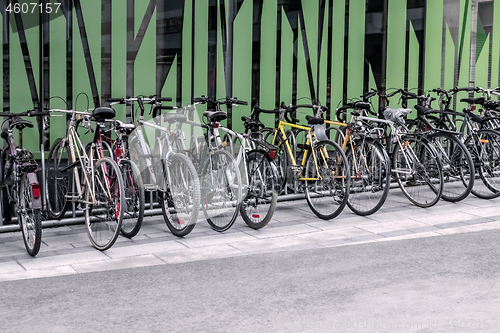 Image of Bicycles near a green wall