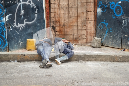 Image of Workers sleeping on a construction site