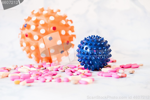 Image of Shot of microscope virus close up and pills. Coronavirus concept Tablet in the fingers of hand