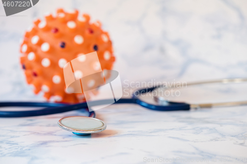 Image of Medical stethoscope or phonendoscope over light blue background Tablet in the fingers of hand