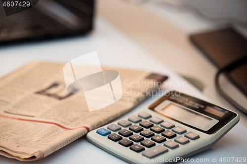 Image of Calculator and finance newspaper. Coronavirus concept. Work from home concept