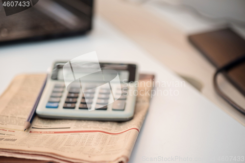 Image of Calculator and finance newspaper. Coronavirus concept. Work from home concept