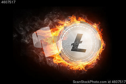 Image of Golden Litecoin coin flying in fire flame.