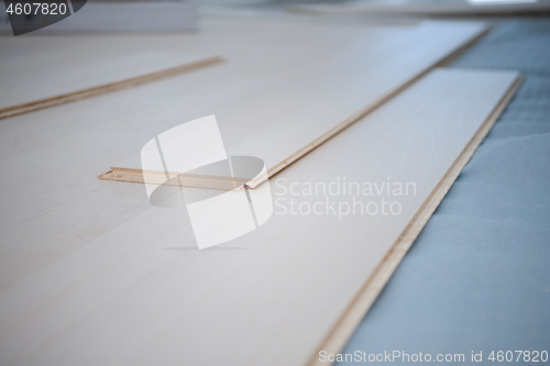 Image of Instalation of laminated floor at home