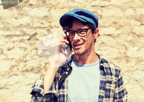 Image of close up of man calling on smartphone outdoors