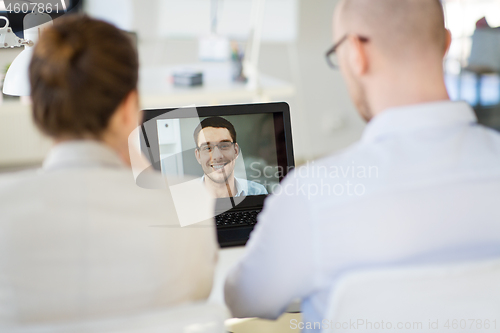 Image of business team having video conference at office