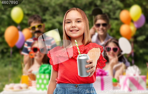 Image of smiling girl with can drink at birthday party